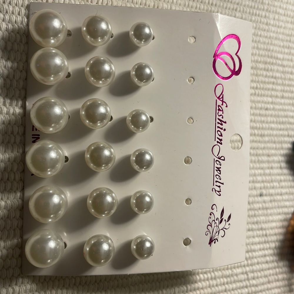 20 pairs of pearl earrings